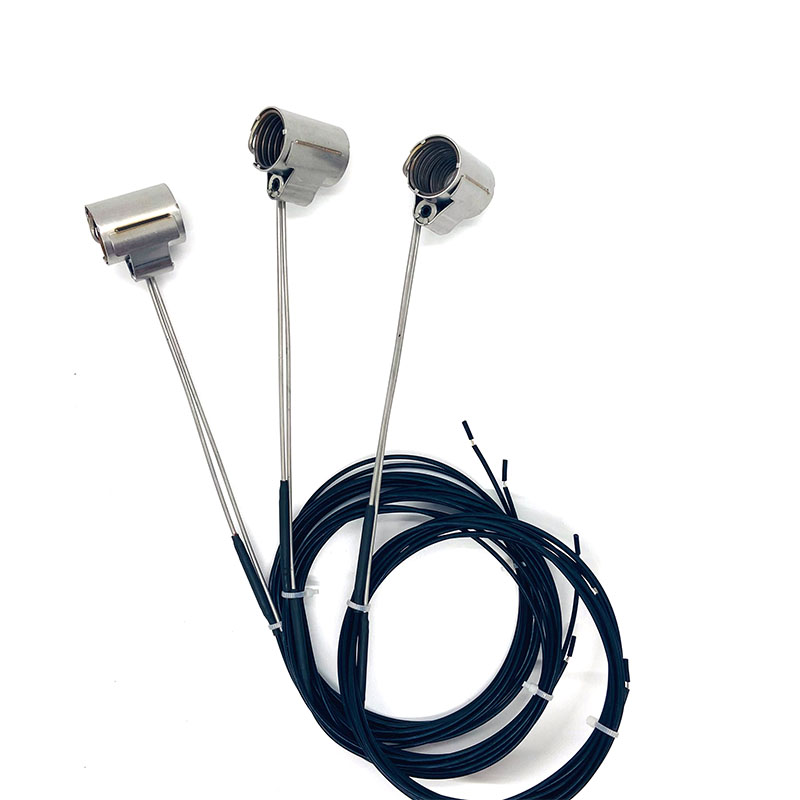 Calentador de canal caliente con bobina de abrazadera axial